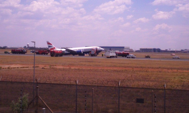 Emergency services rush in aid of British Airways Comair Boeing 737 after it came to a standstill on the runway of OR Tambo airport in Johannesburg. Photograph: Lina Lekgothwane/Demotix/Corbis