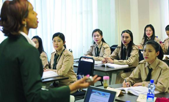 Chinese cabin crew listen to a lesson in a class room on the campus of the Ethiopian Airlines flight academy in Addis Ababa. (AFP)