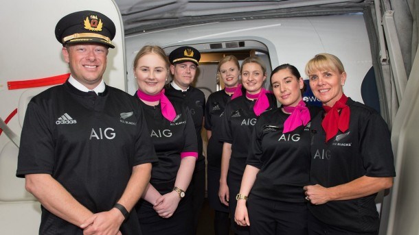 Qantas crew members don their All Blacks jerseys; a commitment to an airline wager with Air New Zealand.
Source: Facebook Qantas