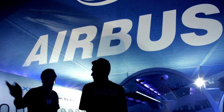 People are silhouetted at the Airbus aviation stand at Farnborough Airshow, 16 July 2006. The Airshow which takes place every two years at Farnborough is a chance for the International Aviation Industry to showcase their latest products and technology. European group Airbus will on Monday 17 July unveil new design plans for its troubled long-haul A350 plane, Thomas Enders, co-chief executive of Airbus's parent company EADS, told reporters. (Photo credit should read CARL DE SOUZA/AFP/Getty Images)