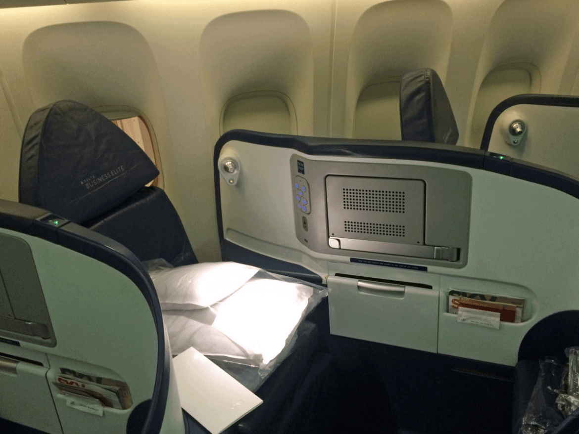 Delta's setup was pretty similar. The seat was the same size as Emirates', although the overall space was smaller. This seat also converted into a lie-flat bed.