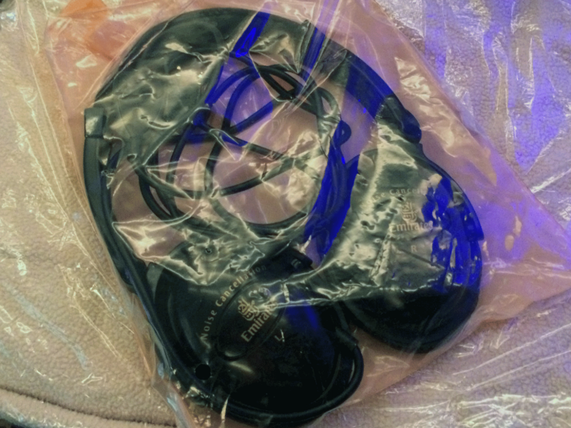 Comfy, noise-canceling headphones from Emirates. They almost blocked out the baby who screamed for most of the flight, but not quite.