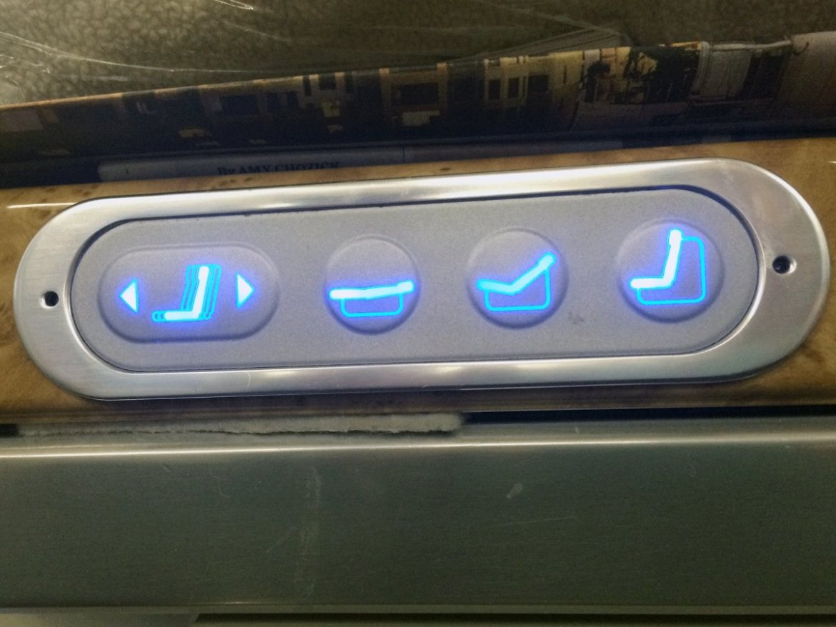 Both seats turned into beds at the push of a button, and adjusted to all different levels for eating and watching TV. Emirates' control panel was pretty straightforward.