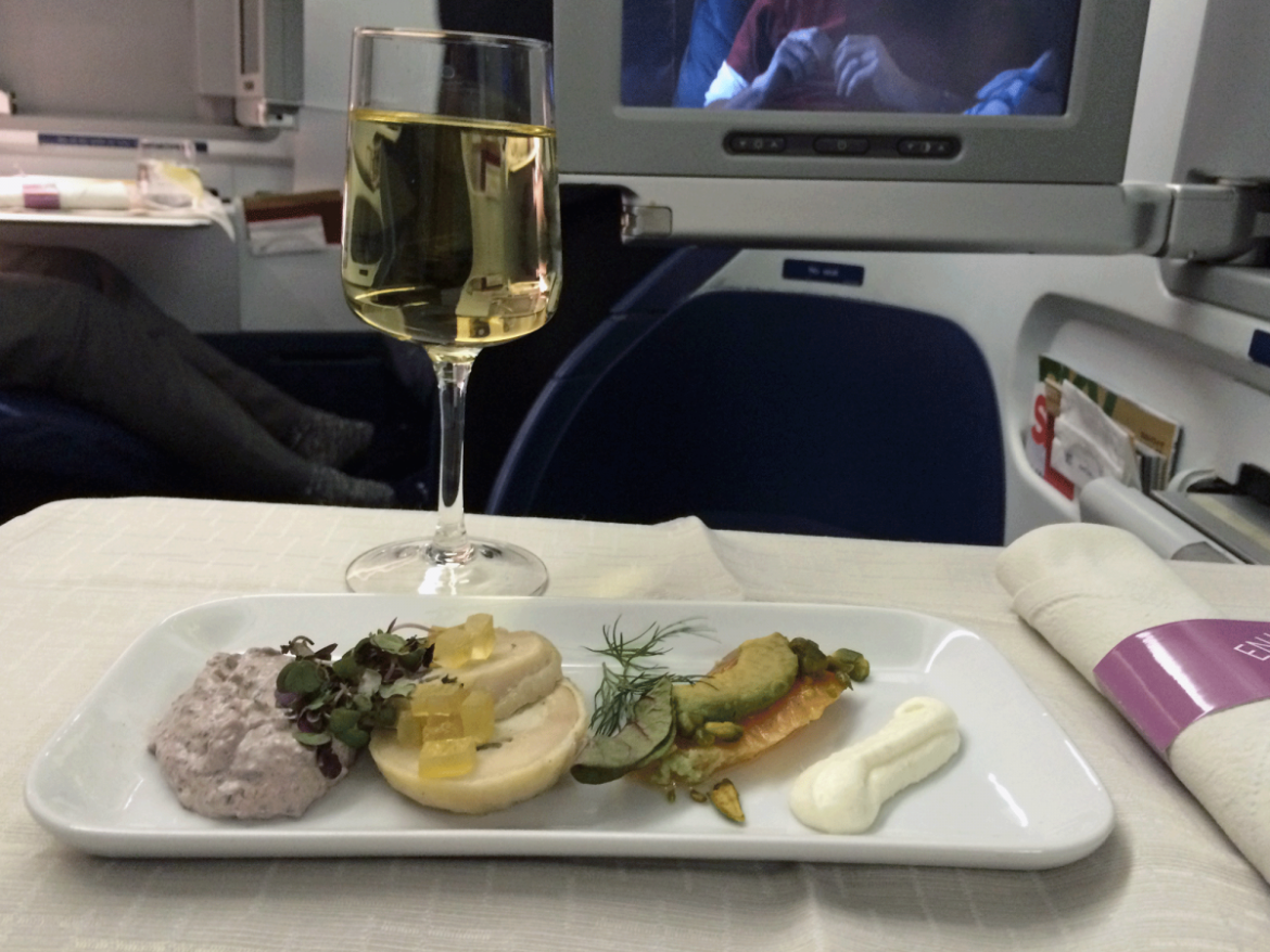 Now for the big one — the food! This was the "snack" I ate right after boarding my Delta flight. That's a "chicken galantine with olive tapenade, cured salmon with wasabi, avocado and roasted pistachio nuts." It was probably the fanciest food I've ever seen served on an airplane, and it was just OK.