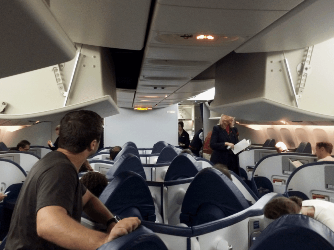 The seats in Delta's Business Class were more worn in — and no fancy lights here. But I liked the herringbone layout, which made each seat feel more private.