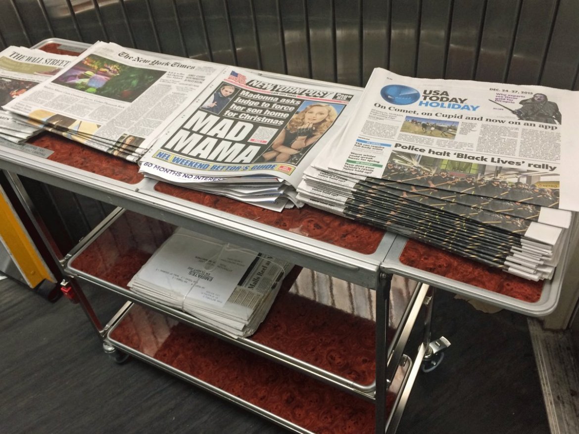 Emirates had a large selection of newspapers available for business class travelers on the jet bridge.
